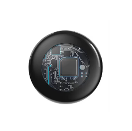 Round black electronic component with circuitry on a white background